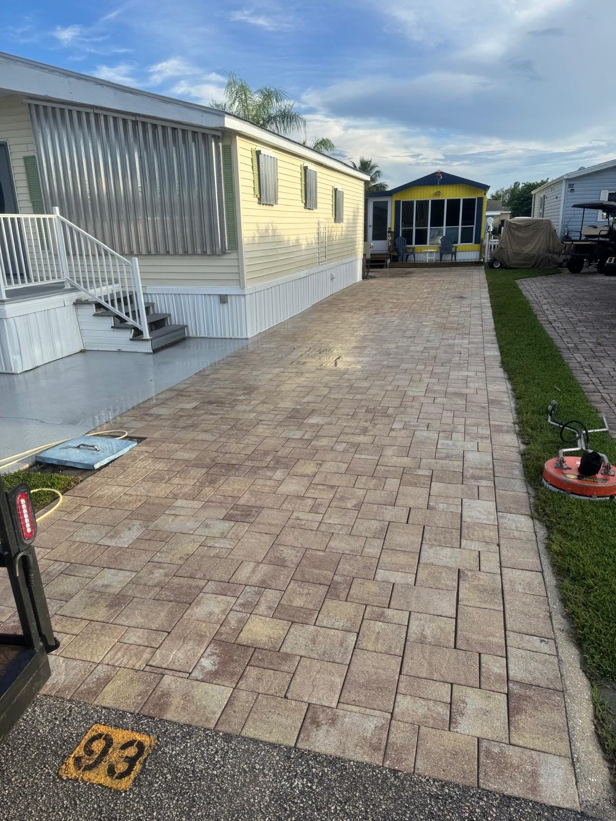 Long paver driveway, washed edge to edge